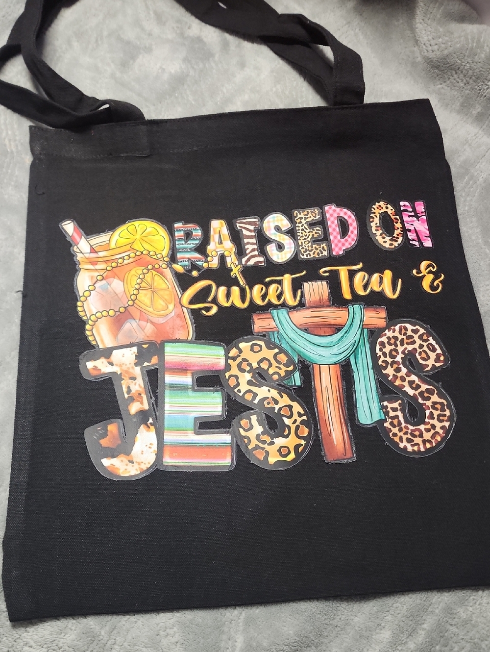Raised On Sweet Tea & Jesus Black Graphic Tote. 13x15.